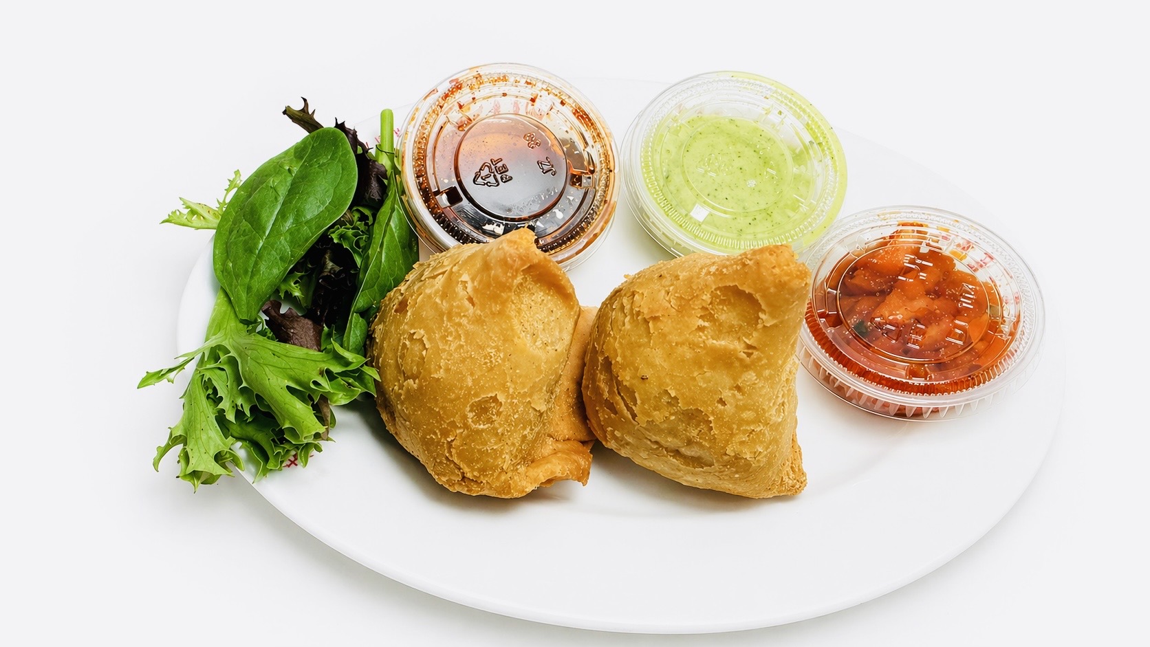 Golden crispy vegetable samosa with mint chutney